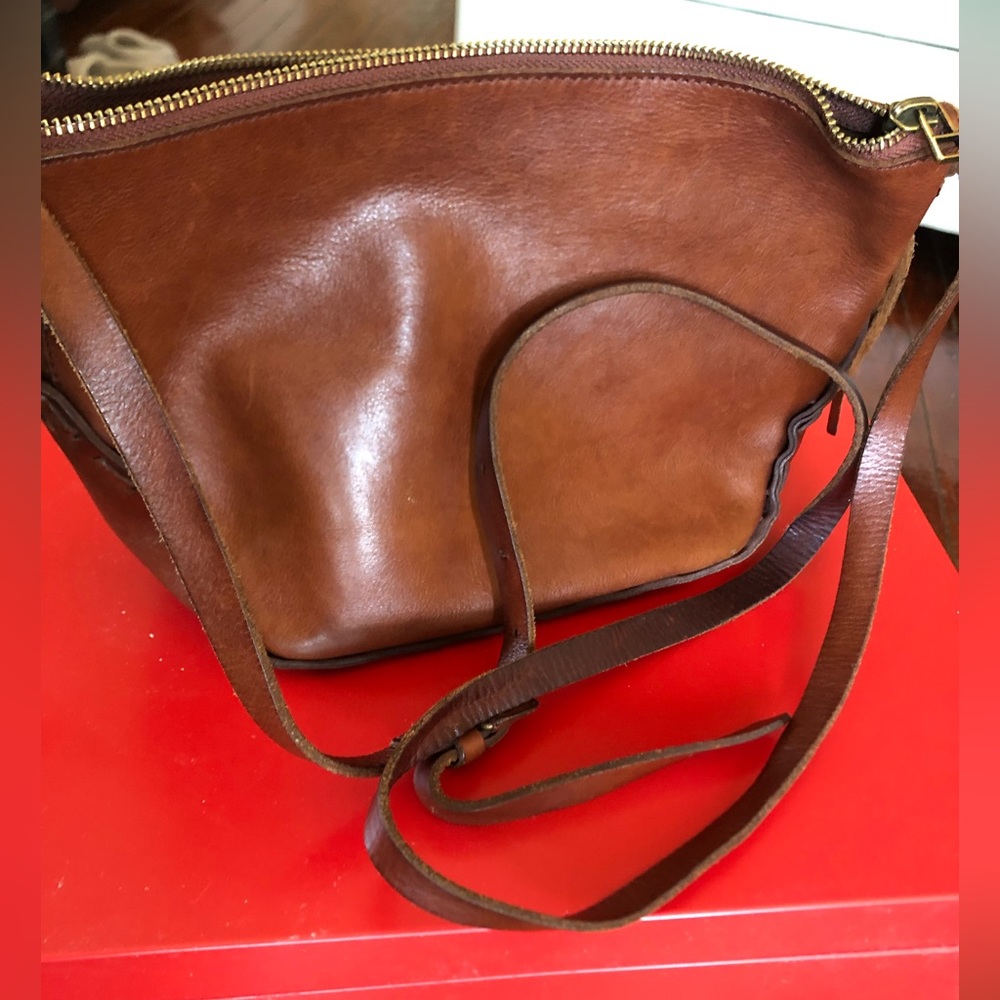 Madewell crossbody bag, brown leather, with leather stitching detail.